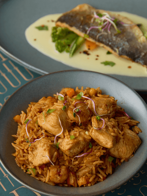 Pan-seared fish in cream sauce with chicken fried rice