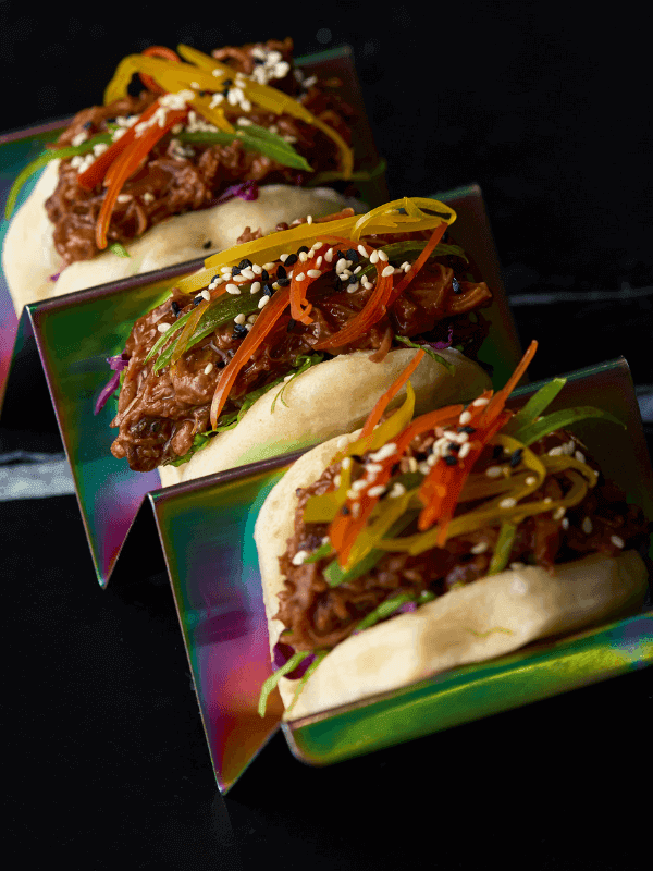 Signature bao buns with slaw and sesame